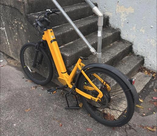 A bike improperly locked up. 