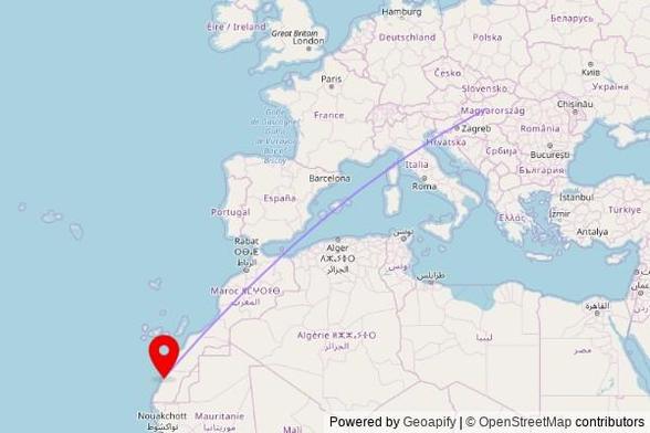A map showing the great circle route from Ócsa in Hungary to a map pin at Church of Our Lady of Carmen, Hassan II Boulevard, Dakhla, Morocco