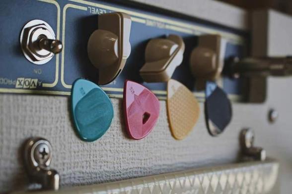 Image from Rombo at Unsplash - Pleks on an amp