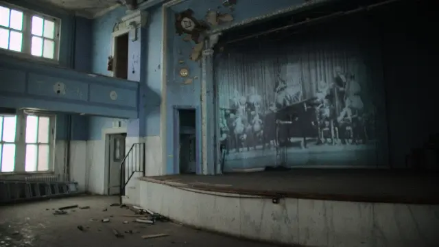 still of the documentary film "The Magic City - Birmingham According to Sun Ra" by Guillaume Maupin & Pablo Guarise - projection of moving images a jazz big band of the 1930's in an old derelect maçonnic building of Birmingham where Sun Ra attended to concerts when he was young