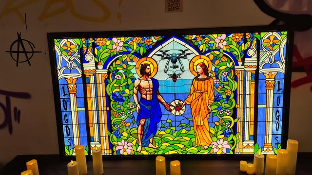 Stained glass window with Adam and Eve looked over by drone