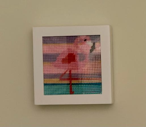 an after photo of a needle point design of a flamingo i worked on
