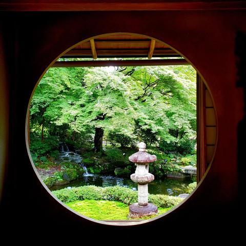 Beautiful round window at the Shimogamo Villa.