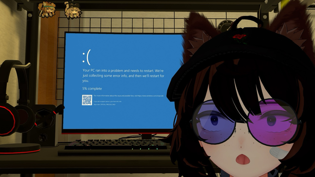 A computer screen displays a Windows blue screen of death with the error message “CRITICAL PROCESS DIED,” while in the foreground an anime-style character with cat ears, a black hat with a red rose, round glasses tinted blue and pink, and a small bandage on their cheek looks surprised. A gaming headset and speakers are visible on the desk.