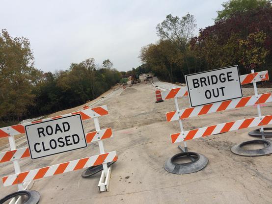 "Road Closed" and "Bridge Out" signs.