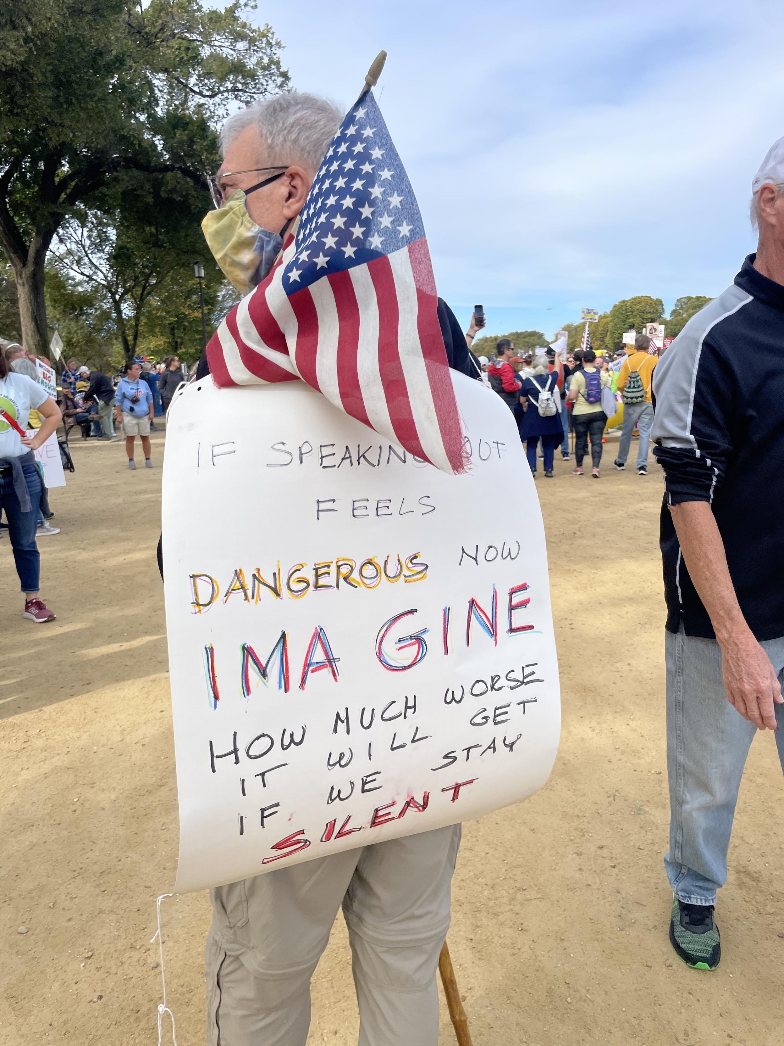 “If speaking out feels Dangerous Now IMAGINE How much worse it will get if we stay Silent” on marcher’s back