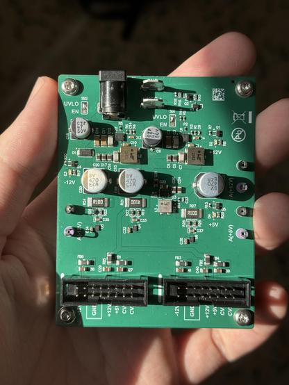 The power supply board fits in the palm of a hand