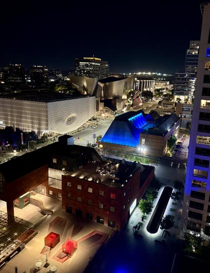 View of Bunker Hill DTLA at night - MOCA in the foreground, The Broad to the left, Disney Concert Hall behind that.