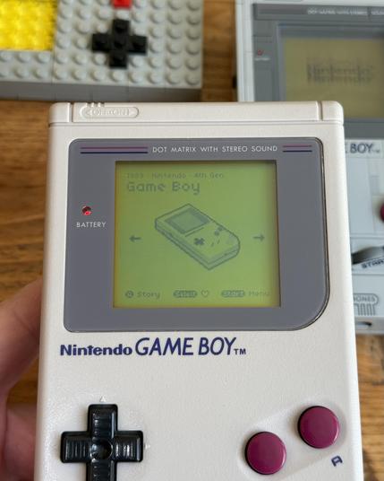 Pixel Game Boy shown in Pocket Collection on an original DMG.