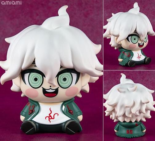 An extremely uncanny chibi figurine of a sitting nagito komaeda with a big open smile. It has buckteeth.