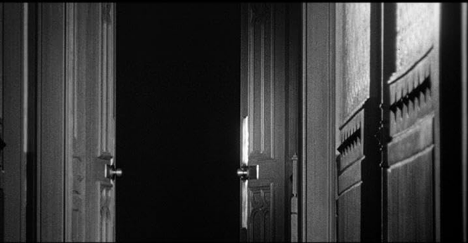 an image of an opened door in the house, dark