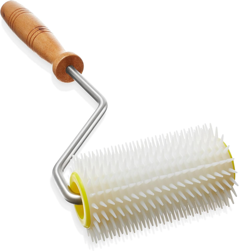 A stock photo of a honey uncapping roller. It is like a narrow paint roller except it has a plastic spiked roller on it.
