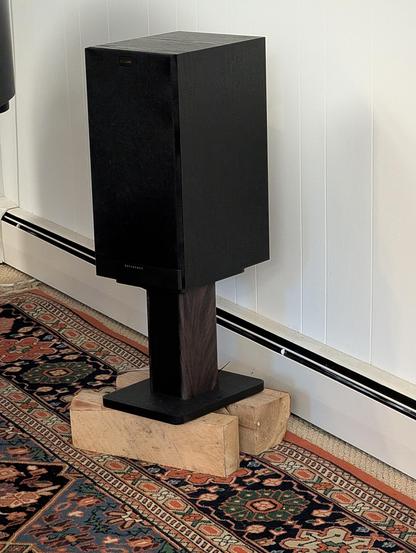 speaker on chopped wood