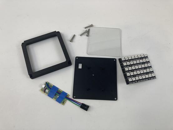 The parts to assemble a NeoPixel light.