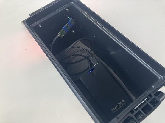 A case with NeoPixel matrix on the back and a battery and controller inside.