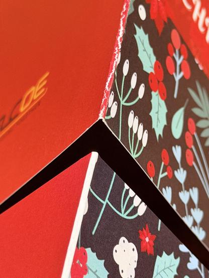 Two versions of a folded greeting card. The top one demonstrates how the ink cracks apart when folded if scoring equipment isn't used. The bottom card was edited to add a white line down the middle. Technically the heavy paper still cracks, but since the ink isn't split apart, it really isn't noticeable.