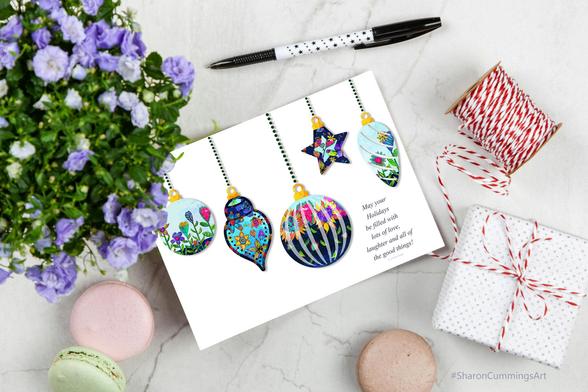 Colorful ornaments with seasons greetings by Sharon Cummings.