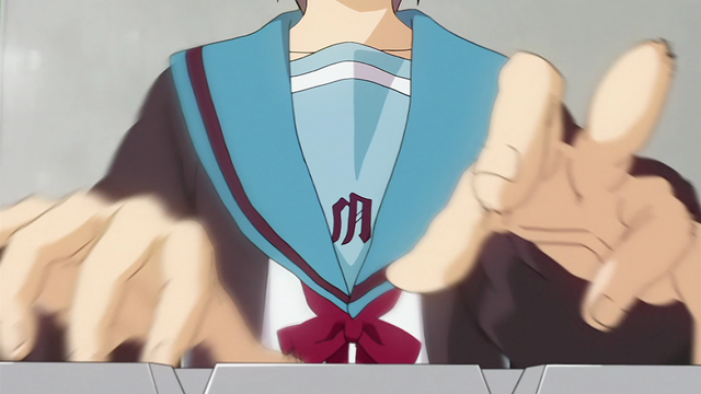 A girl, seen from the perspective of the keyboard, with hands appearing to be moving quickly.