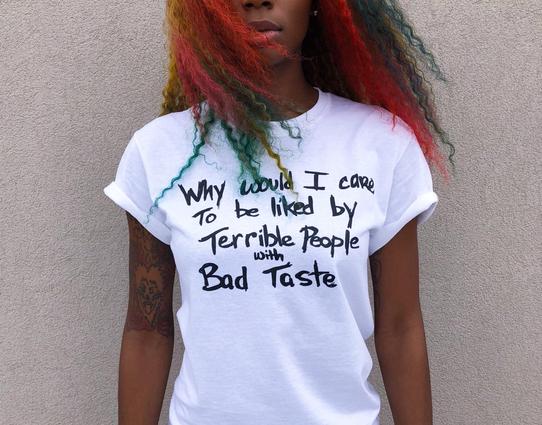 white tee with black text worn by Junglepussy

text: why would I care to be liked by terrible people with bad taste