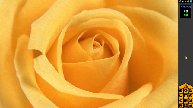 Fondo de escritorio con foto del centro de una rosa amarilla  junto con el panel vertical en el lado derecho, en gris oscuro, con los iconos de los programas en amarillo anaranjado, el reloj, el sensor de temperatura, el control de volumen y el área de notificación.