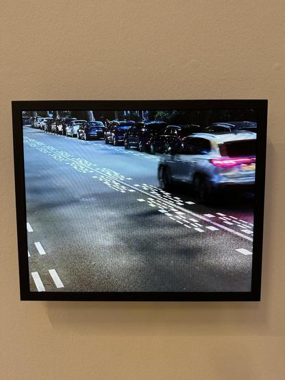 Video screen shows road surface with these 30 lines in the middle, passing car