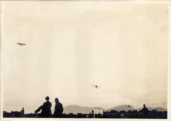 Aviator Charles F. Niles flying his biplane