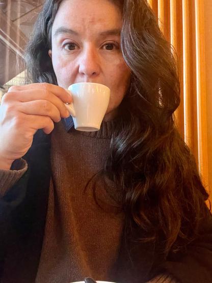 me looking despondent and drinking an espresso 