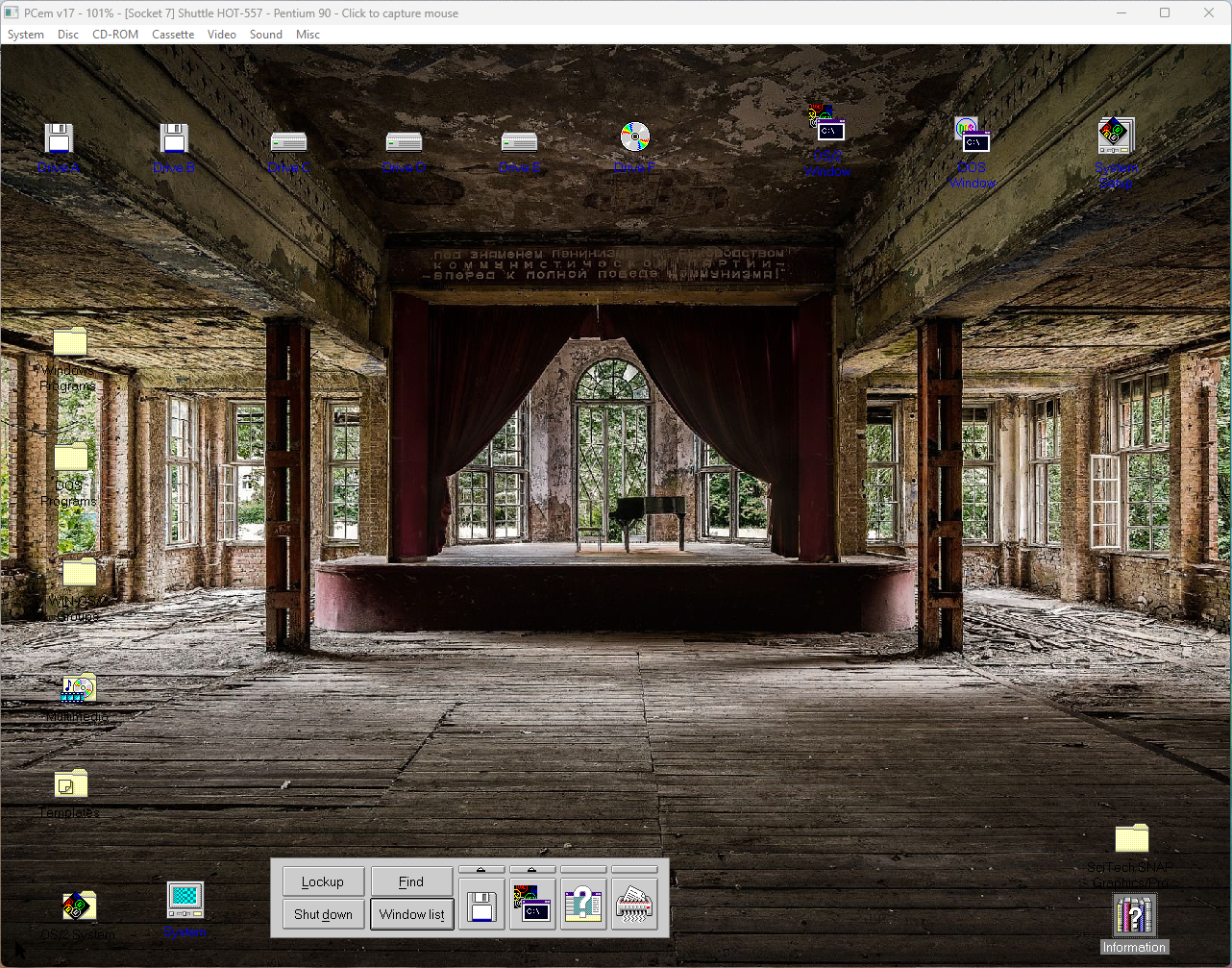OS/2 3 Desktop at 1280x960x24. The wallpaper is a ruined theatre somewhere that uses Cyrillic. There are windows all around (that would have been hidden behind curtains), and a stage with a grand piano framed by tattered curtains. The wooden floor is partially torn up and the paint is peeling on the concrete roof.
