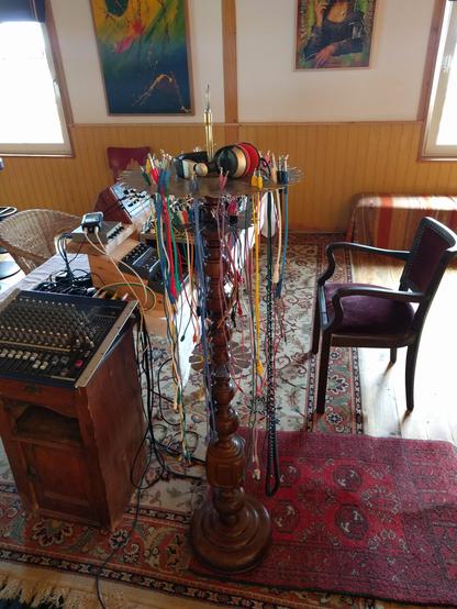 The wiring harness hanging down from above with lots of cables