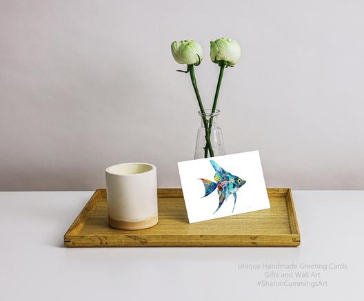 Colorful angelfish on white by artist Sharon Cummings.