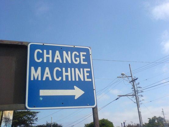 personal change is easy: a photograph of an outdoor sign that says "CHANGE MACHINE" with a directional arrow