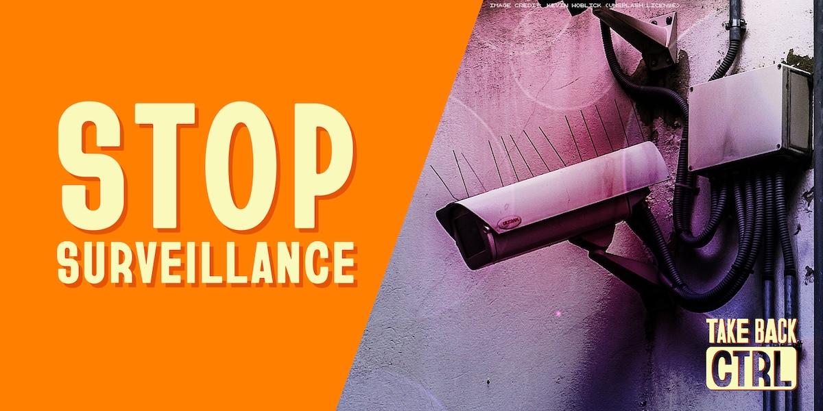 the text "STOP SURVEILLANCE" next to a surveillance camera