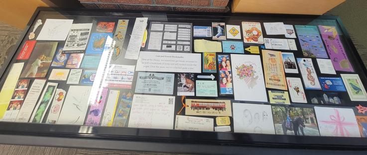 Collection of bookmarks under a glass display case