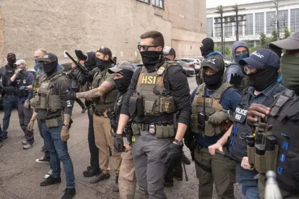 A photo of Homeland Security Nazis attacking a US city.  