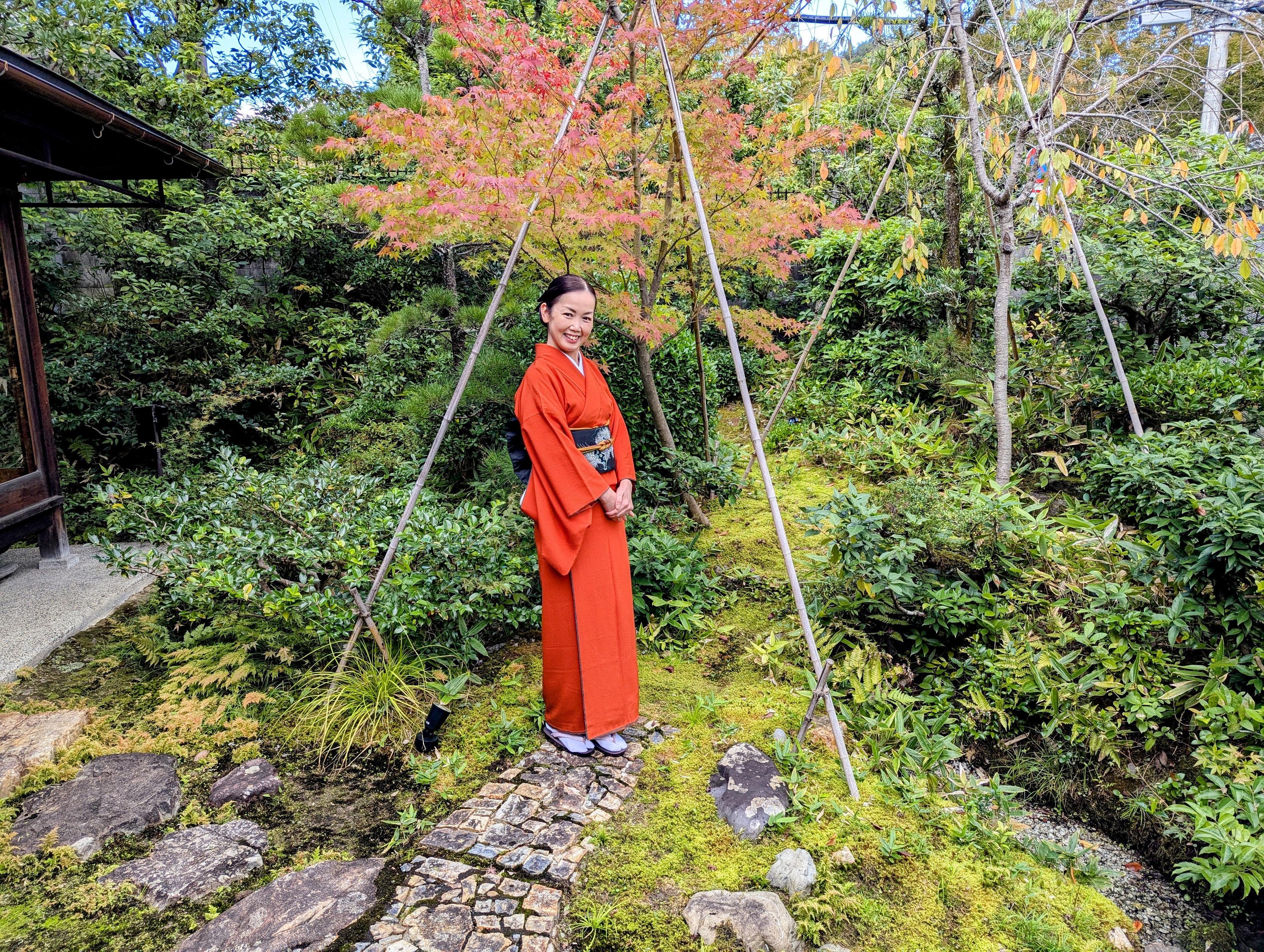 Atsuko-san dressed in an orange kimono and black obi, a nod to the Jack-o'-lanterns found at this time of year.