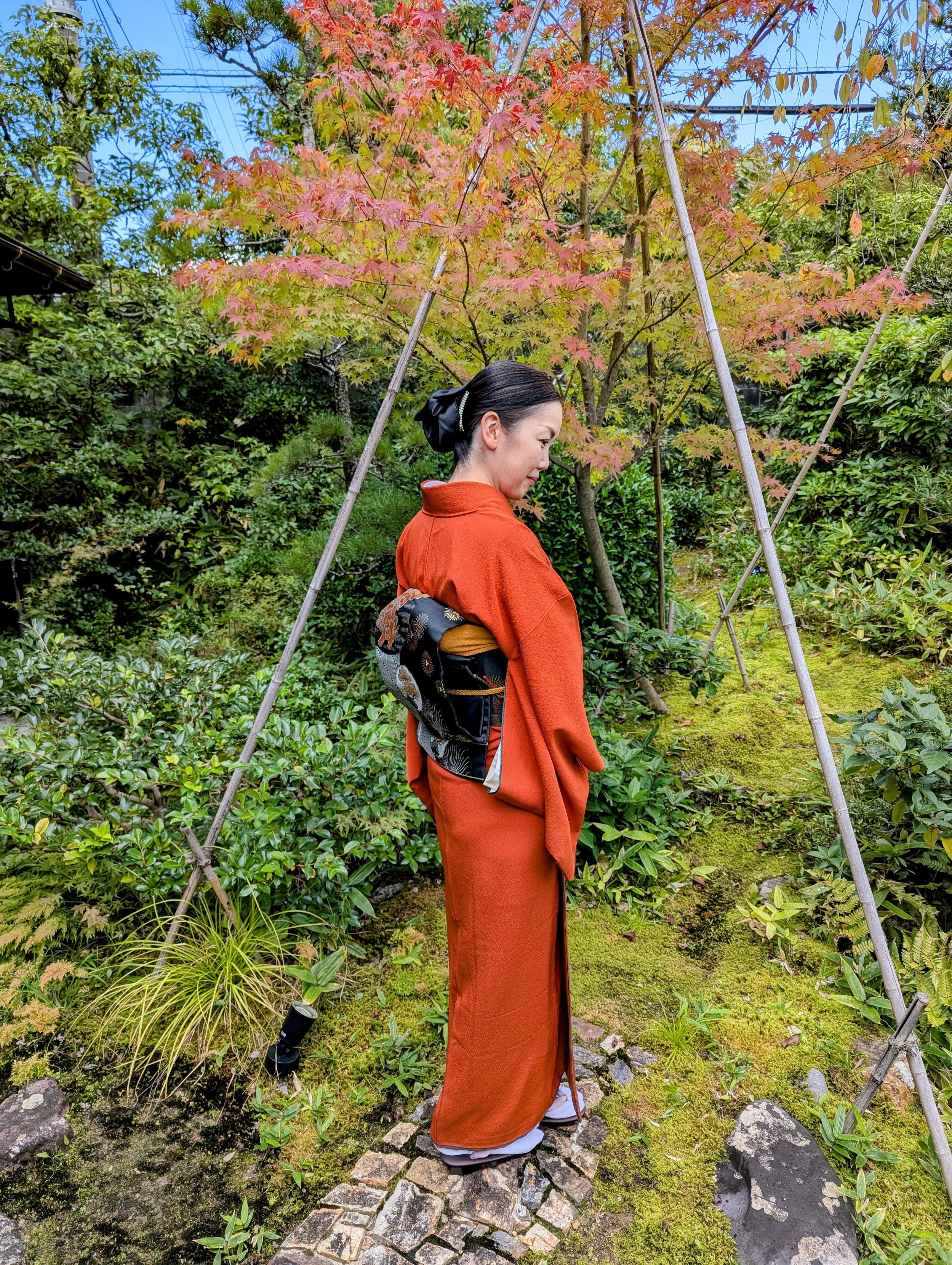 Atsuko-san dressed in an orange kimono and black obi, a nod to the Jack-o'-lanterns found at this time of year.