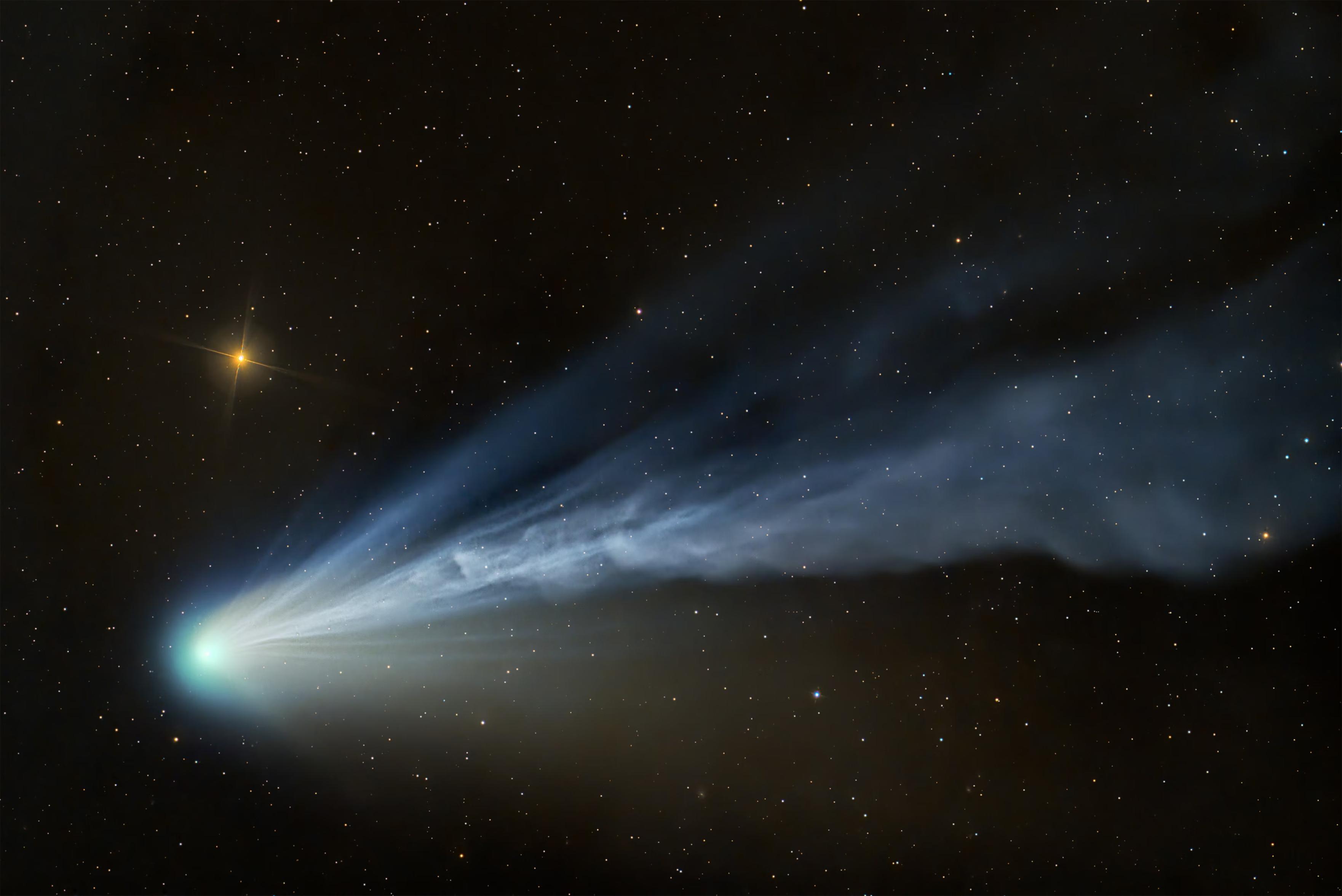 Comet 12P/Pons-Brooks reacts to intensified solar winds, creating a spectacle of tail dynamics and colourful hues expelled by the bright cloud of gas around its centre.