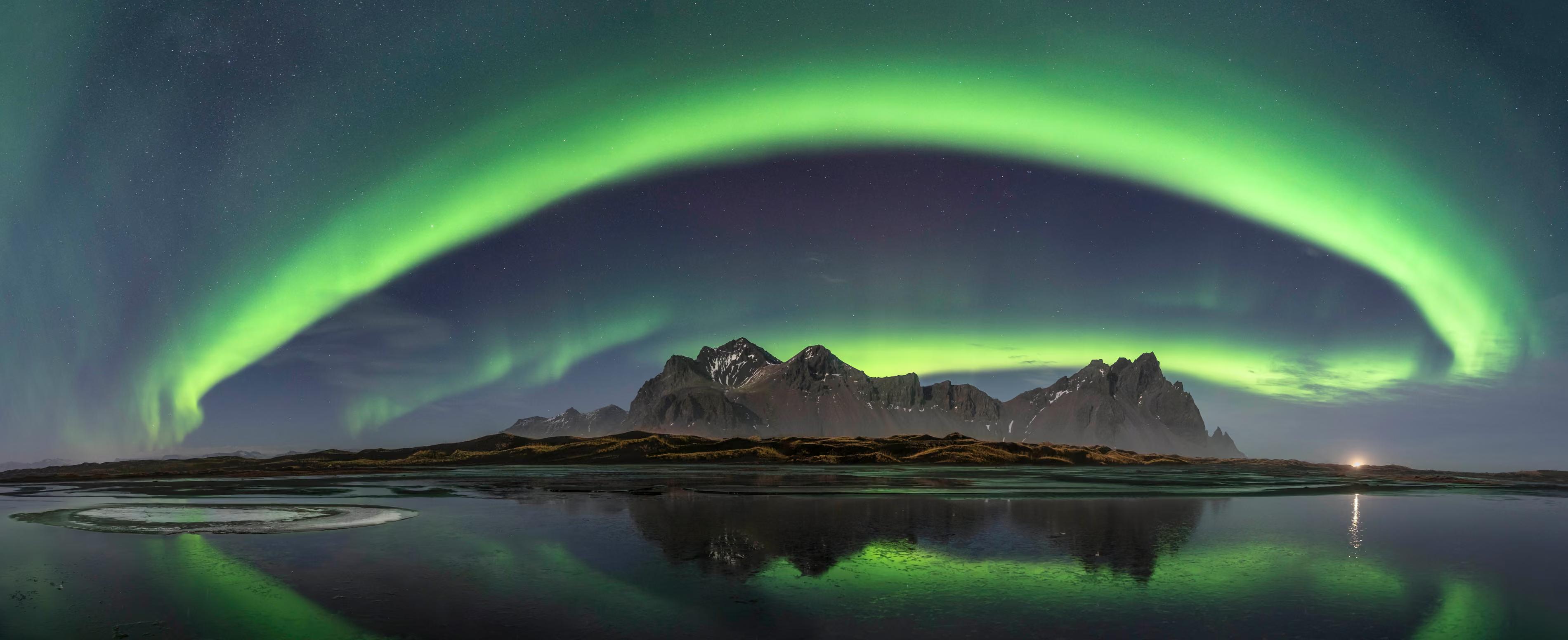 The gigantic and perfect green neon sign illuminates the entire sky in Iceland last December.
