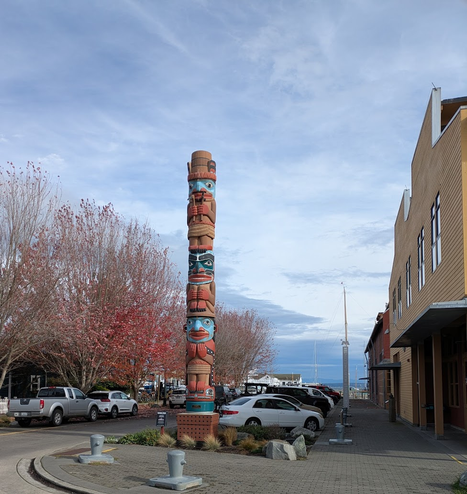 Port Townsend is a bit reminiscent of a tiny British town around 1892, but also has a strong native heritage and tries to keep the culture alive through art, walking paths, naming, and other reminders. This welcome pole by the Northwest Maritime Center was a gift from the Jamestown S'klallam Tribe.