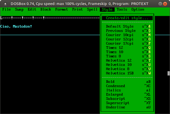La videoscrittura ProText aperta sotto Linux con l'emulatore DosBox. Si notano i font, gli stili di stampa e le parole "Ciao, Mastodon!" nell'area di composizione