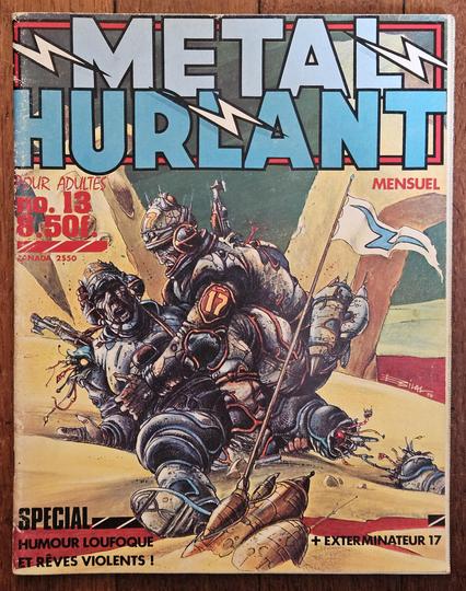Métal Hurlant magazine issue number 13, January 1977, featuring art by Enki Bilal featuring two warrior robots in pretty bad conditions, from the Exterminateur 17 story. Mention is made of this issue being special wacky humor and violent dreams.