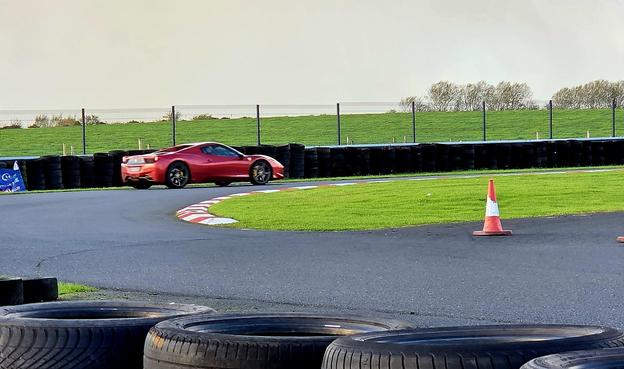 timf in a Ferrari 458 Italia, taking a corner