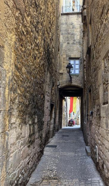 A view down an alley to a table set for two