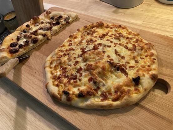 One and a half baked pizzas.