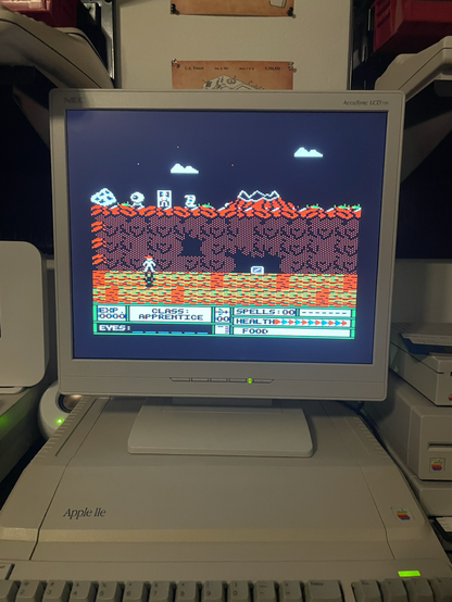 Guy sitting above a cave. 