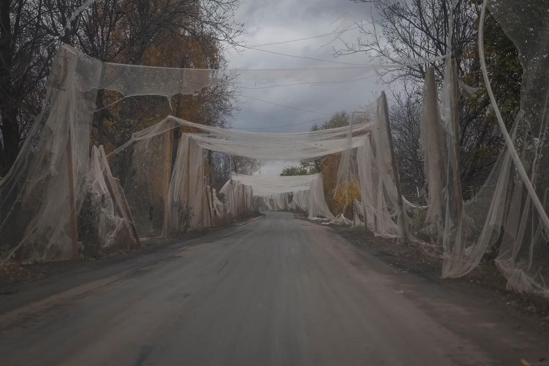 Anti-drone nets installed over a road in the frontline town of Kostiantynivka in the Donetsk region, Ukraine, November 1. REUTERS/Yan Dobronosov