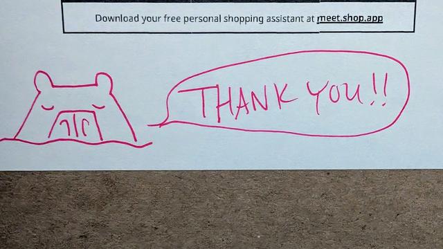 Photo of a drawing on packaging. A pink ink drawing of a capybara under water with a speech bubble to the right saying, "THANK YOU!!" Above is a rectangle with the text, "Download your free shopping assitant at meet.shop.app."
