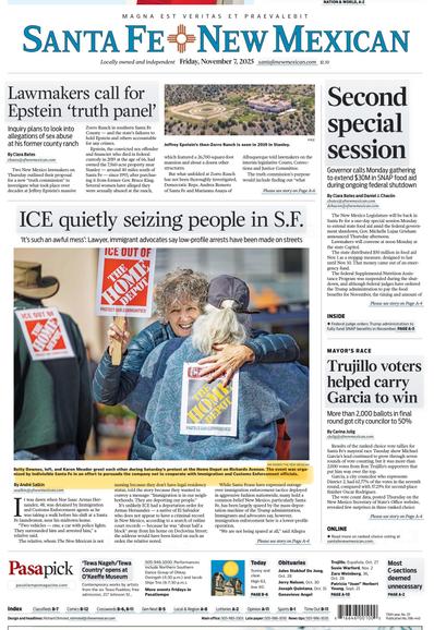 Front page of the The New Mexican featuring a large photo of two women embracing. One is carrying an ICE out of Home Depot sign. The other is wearing one on her back. There is another protester in the frame also wearing a sign on his back. The headline of the story reads “ICE quietly seizing people in Santa Fe.”
