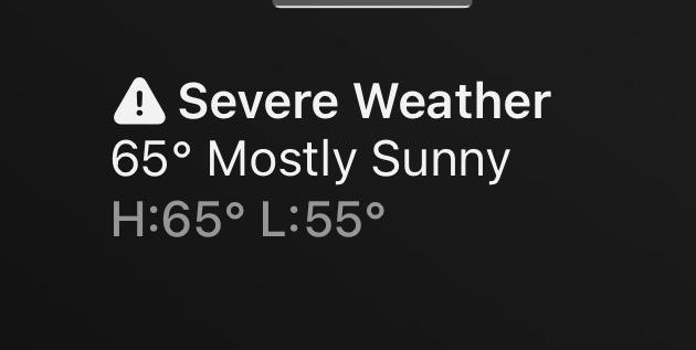 screenshot of weather report on iPhone that says "severe weather and then 65° mostly sunny high 65° low 55°"