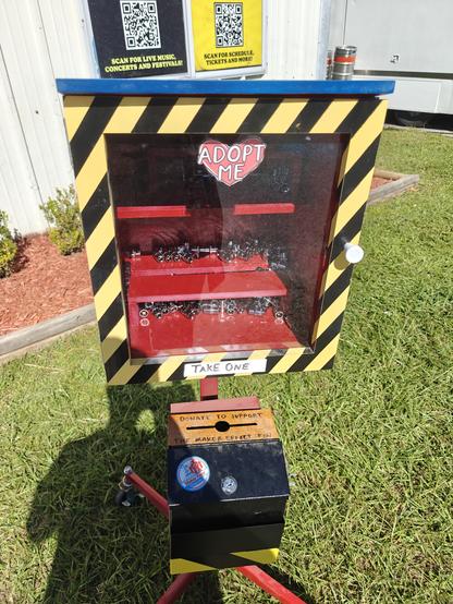 A box filled with 10 mm sockets and a "take one" sign